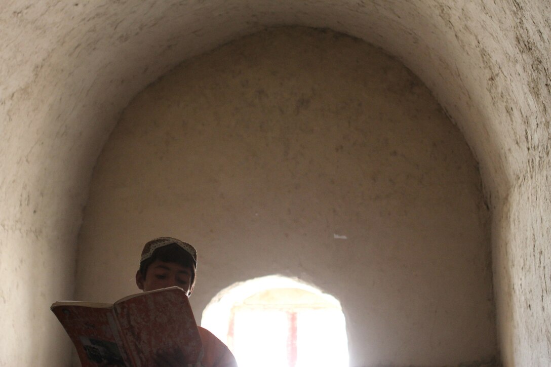 A student recites a poem in Pashto during class here Feb. 25, 2012. Marines serving with Team 3, Civil Affairs Detachment 11-2, provided guidance to the local government in Khan Neshin to help them construct a new school. Brooks said visiting the school is the highlight of his deployment. The current school is made of mud and mortar, is overcrowded and only has enough capacity to hold up to sixth grade. The new school will have up to eighth grade and have more than enough room for students and teachers. Brooks is from Celeste, Texas, and is serving under Regimental Combat Team 5 and alongside 1st Light Armored Reconnaissance Battalion in Helmand province.