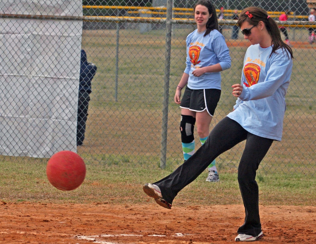Representing 2nd Battalion, 9th Marine Regiment, 2nd Marine Division, Ashley Bourne, a player for the 2/9ettes, kicks the ball during the Spouses Lejeune Area Kickball Association opening day tournament aboard Marine Corps Base Camp Lejeune, N.C., Feb. 26. The league started with only two teams and has since grown into 24.