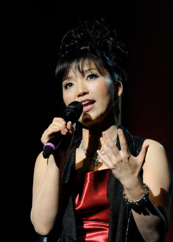 Keiko Matsui introduces her next song during a performance with the United States Air Force Band's Guest Artist Series at the at Daughters of the American Revolution Constitution Hall in Washington, D.C. on Feb. 26. Matsui’s best-selling album, “Moyo,” featuring the hit single, “Black River,” made the Billboard Contemporary Jazz music chart for 36 weeks. (U.S. Air Force photo/ Staff Sgt. Nichelle Anderson)