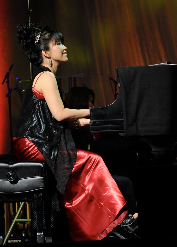 Keiko Matsui performs with the United States Air Force Band as part of the Guest Artist Series at the Daughters of the American Revolution Constitution Hall in Washington, D.C. on Feb. 26. With more than 1.5 million albums sold, this marked the famed musician's third appearance as a guest artist with the USAF Band. (U.S. Air Force photo/ Staff Sgt. Nichelle Anderson)