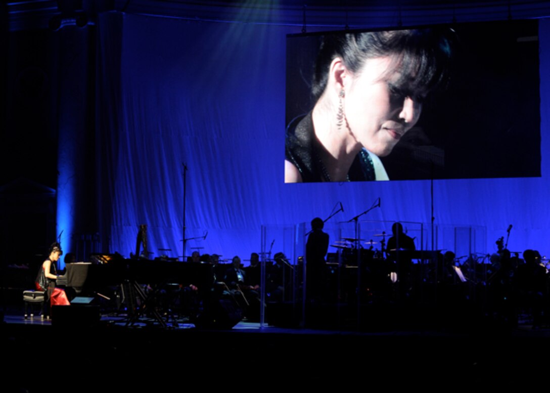 Keiko Matsui, the “first lady of contemporary jazz,” performs with the United States Air Force band as the guest artist at the at Daughters of the American Revolution Constitution Hall in Washington, D.C. on Feb. 26.  Matsui has dozens of highly-acclaimed recordings to her credit including “Sapphire” and “Deep Blue,” both of which reached number one on Billboard’s Contemporary Jazz chart. (U.S. Air Force photo/ Staff Sgt. Nichelle Anderson)