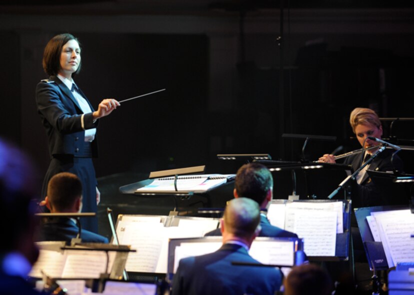 2nd Lt. Shanti C. Nolan, U.S. Air Force Band conductor, guides artists in song during the 47th Annual Guest Artist Series at Daughters of the American Revolution Constitution Hall in Washington, D.C., on Feb. 26. The USAF Band has endeared itself to millions of listeners for 70 years through its exhilarating music, engaging concerts and masterful recordings. (U.S. Air Force photo/ Staff Sgt. Nichelle Anderson) 