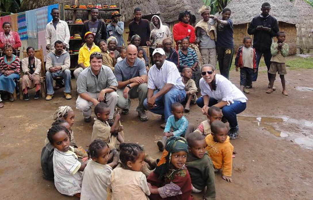 OSI agents from Region 5 support a variety of Air Force operations around the world. OSI Special Agent Christopher Wilbern, SA Matthew Brigham and their linguist recently visited a local tribe in Dorze Village, Ethiopia. These agents were deployed to Ethiopia in support of the 17th Air Force.  It was through Region 5’s support of this type of operation and many others that they were recognized with the Air Force Outstanding Unit Award. Pictured here is, from left, SA Wilbern, SA Brigham, OSI’s linguist, and an Air Force Special Operations Command member. (U.S. Air Force Photo.)
