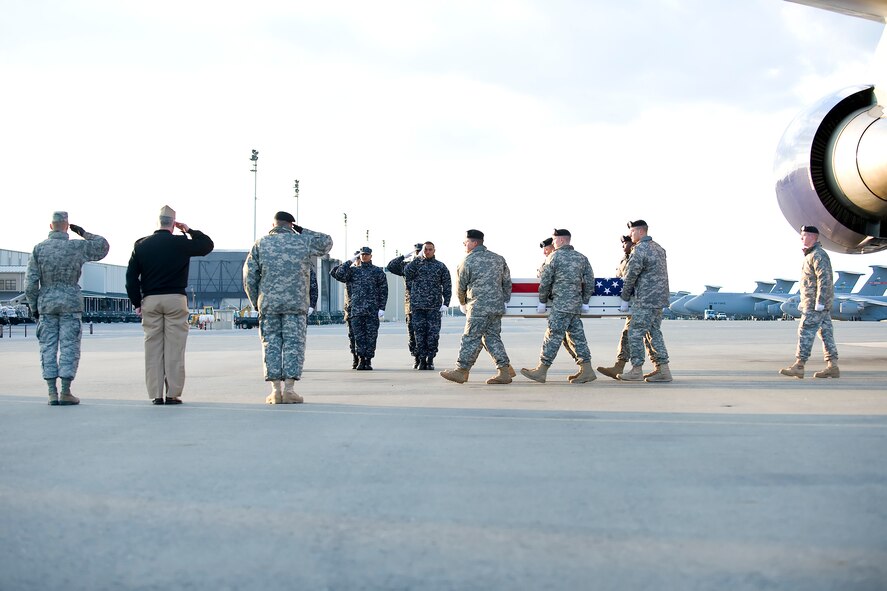 A U.S. Army carry team transfers the remains of Army Sgt. Joshua A. Born of Niceville, Fla., at Dover Air Force Base, Del., Feb. 25, 2012. Born was assigned to the 385th Military Police Battalion, 16th Military Police Brigade (Airborne), XVIII Airborne Corps, Fort Stewart, Ga. (U.S. Air Force photo/Adrian R. Rowan)