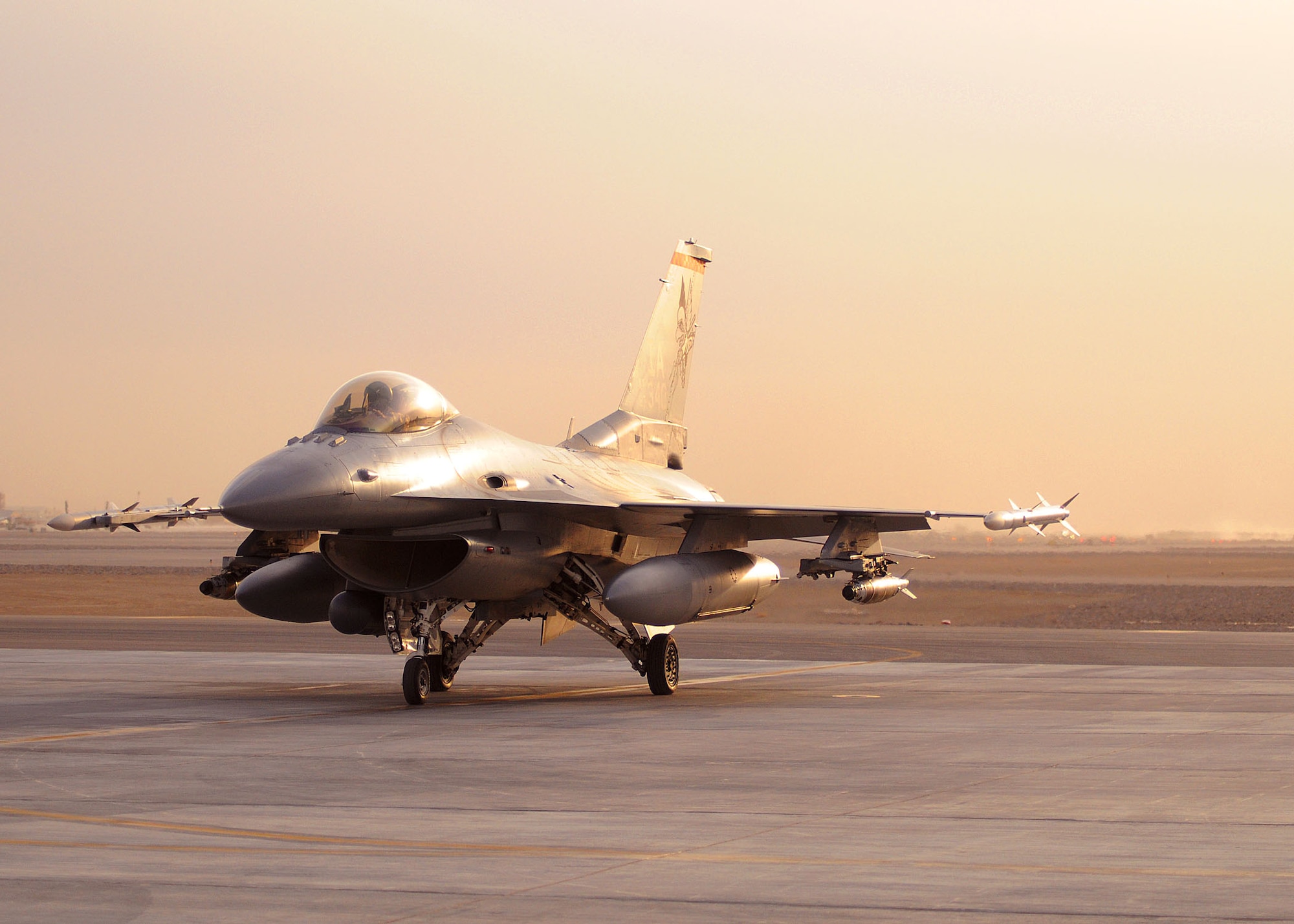 An F-16 Fighting Falcon lands at Kandahar Airfield, Afghanistan Feb. 16, 2012. The jet, originally deployed from Bagram Airfield, moved to Kandahar Airfield because of a close air support reset that also involved an A-10 unit migrating north to Bagram Airfield. (U.S. Air Force photo by Staff Sgt. Heather Skinkle) 

