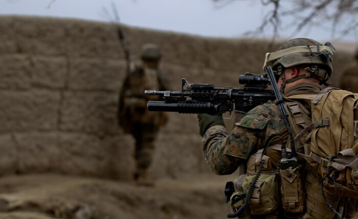 Corporal Ian Ward, a squad leader with 3rd Platoon, Lima Company, searches for anything suspicious through the scope of his rifle, while on patrol Feb. 26, 2012. Ward, currently deployed with 3rd Battalion, 7th Marine Regiment, mentored his Marines throughout his deployment the same way he was mentored. Ward said as a squad leader he looks after his Marines physical and mental health.