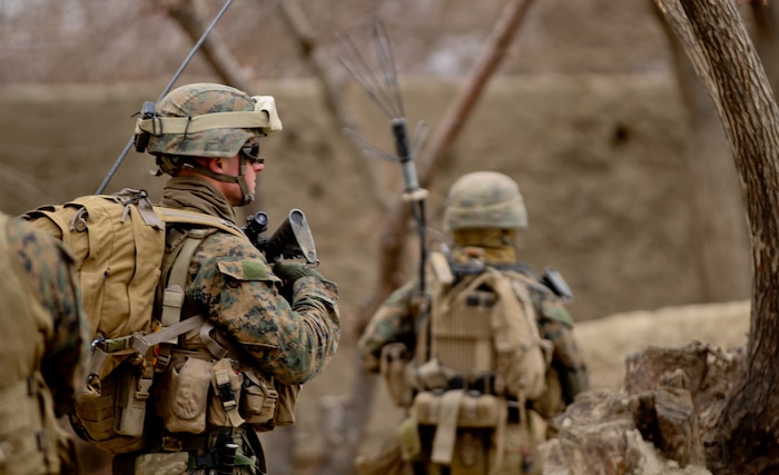 Corporal Ian Ward, a squad leader with 3rd Platoon, Lima Company, patrols through a village, near here Feb. 26, 2012. Ward said he saw a change from when he was in Sangin, a year ago. Adding since deploying again, there have been substantial less firefights for the Marines.