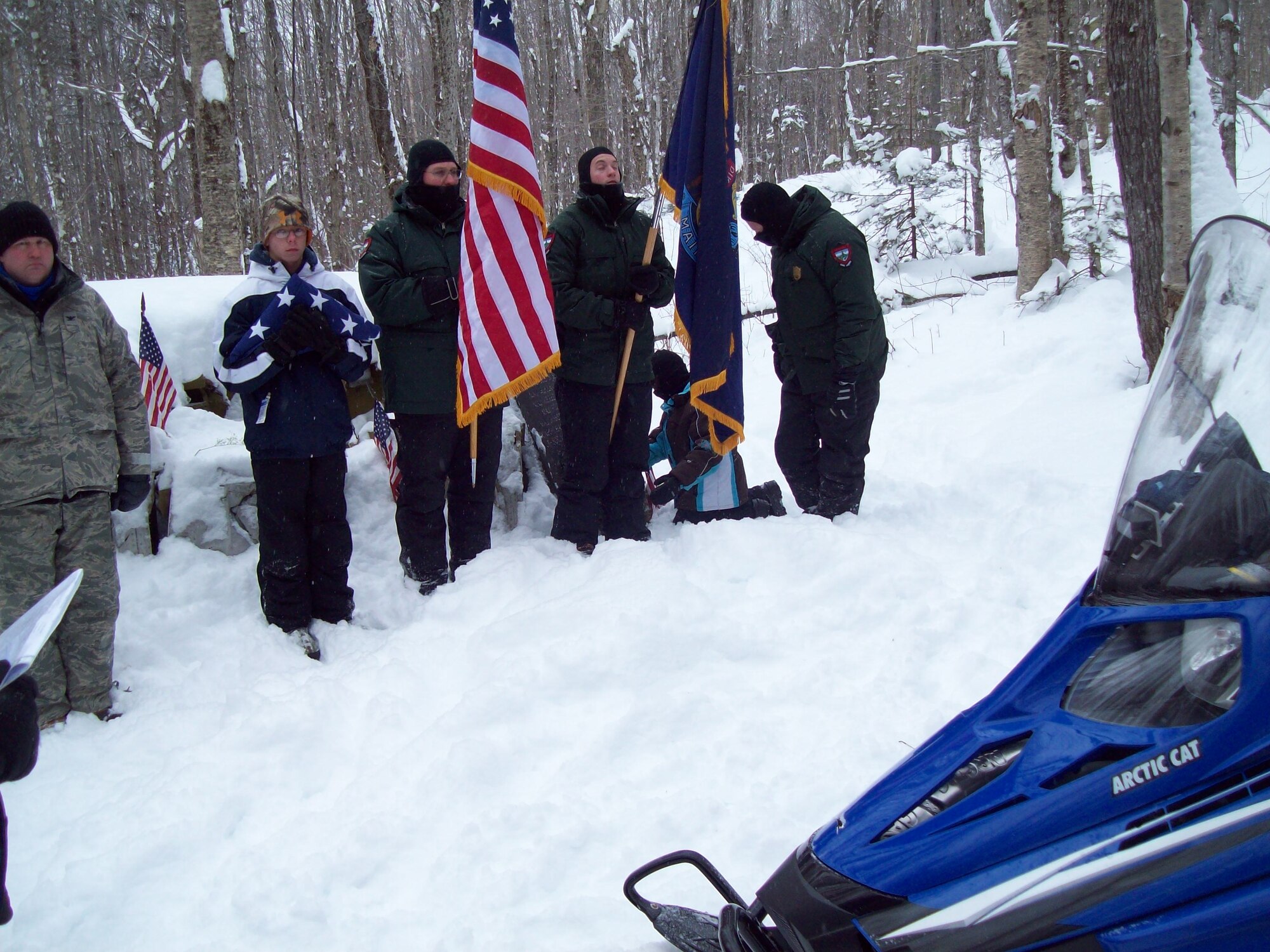Members of the Maine Rangers and Maine Air National Guard brave 5 degree weather to provide an honor guard detail at a memorial service Jan. 2012. The memorial service honored a lost B-52 Stratofortress bomber crew from the 99th Bomb Wing at the crash site, Piscataquis County, Maine. The aircraft crashed during a test mission on Jan. 24th, 1963 after encountering severe winter weather and losing its vertical stabilizer. Today, surviving relatives and concerned citizens hold an annual memorial service at the crash site. (courtesy photo)
