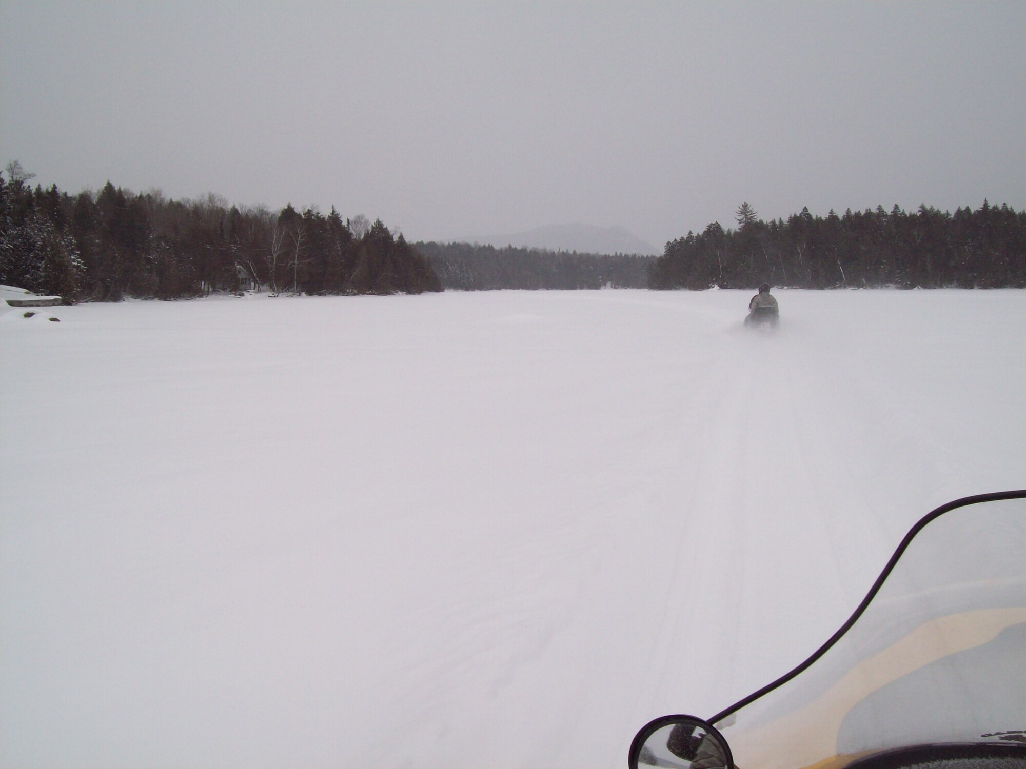 Members of the Moosehead Riders snowmobile club ride to the crash site, Piscataquis County, Maine. The aircraft crashed during a test mission on Jan. 24th, 1963 after encountering severe winter weather and losing its vertical stabilizer. Today, surviving relatives and concerned citizens hold an annual memorial service at the crash site. (courtesy photo)