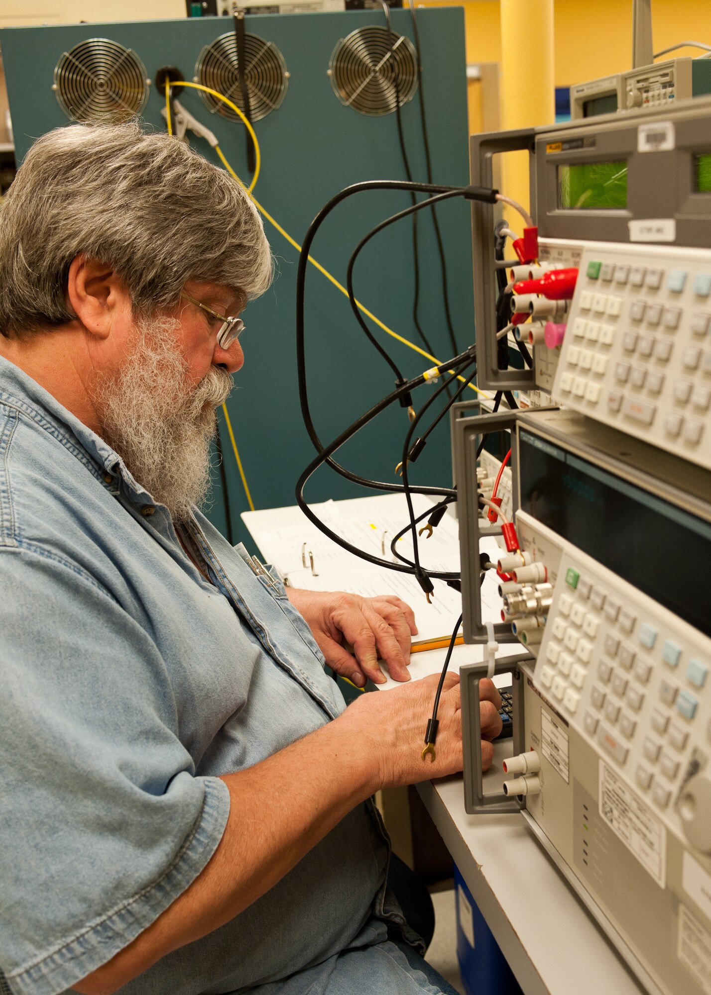 Charles Eickhoff, 28th Maintenance Squadron calibration technician, calibrates a multi-calibrator during precision checks on Ellsworth Air Force Base, S.D., Feb. 16, 2012. These tests ensure that the precision measurement equipment laboratory is able to provide the most accurate readings possible. (U.S. Air Force photo by Airman Alystria Maurer/Released)