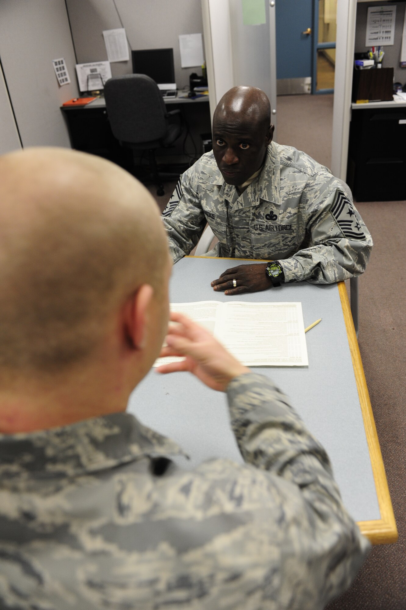 Airman 1st Class Sean Sussman, 56th Civil Engineer Squadron, helps Chief Master Sgt. Rory Wicks, 56th Fighter Wing command chief, prepare his taxes in the tax center at Luke Air Force Base.  Twenty-five IRS-trained volunteers are available to help 8:30am to 4:30pm, by appointment preferred, Tuesday, Wednesday and Thursday at the tax center.  (U.S. Air Force photo by Staff Sgt. Jason Colbert)
