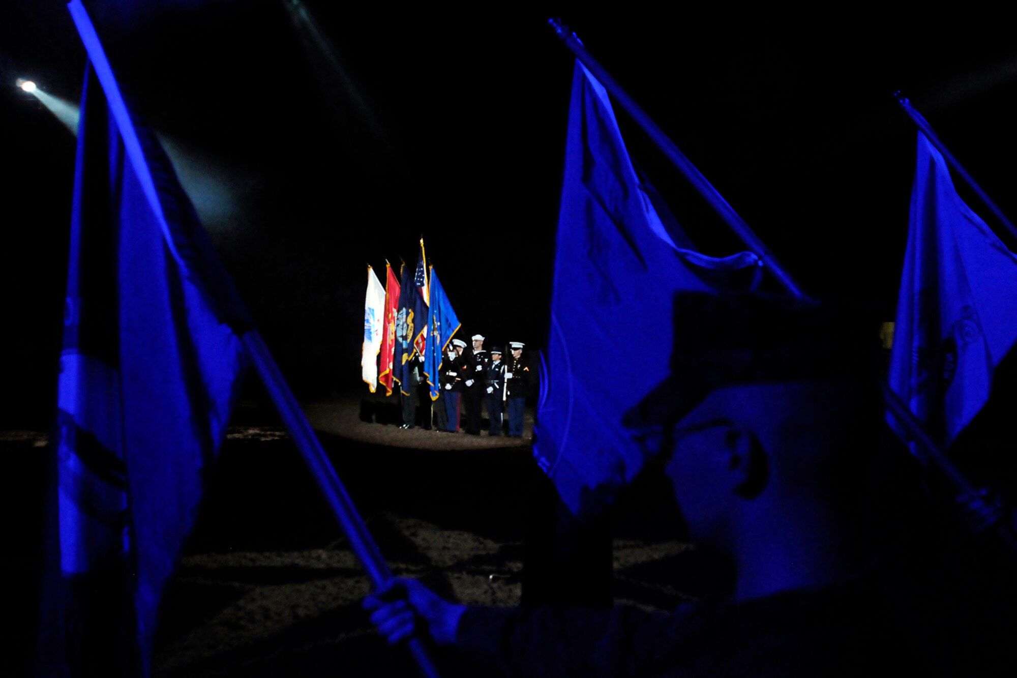 SAN ANGELO, Texas -- Marines from the Marine Corps Detachment, Goodfellow Air Force Base, hold state flags as the Goodfellow Joint Service Color Guard present the colors during military appreciation night opening ceremonies of the 80th Annual San Angelo Stock Show and Rodeo Feb. 22. Goodfellow's Patriot Blue performed the national anthem. (U.S. Air Force photo/Staff Sgt. Austin Knox)