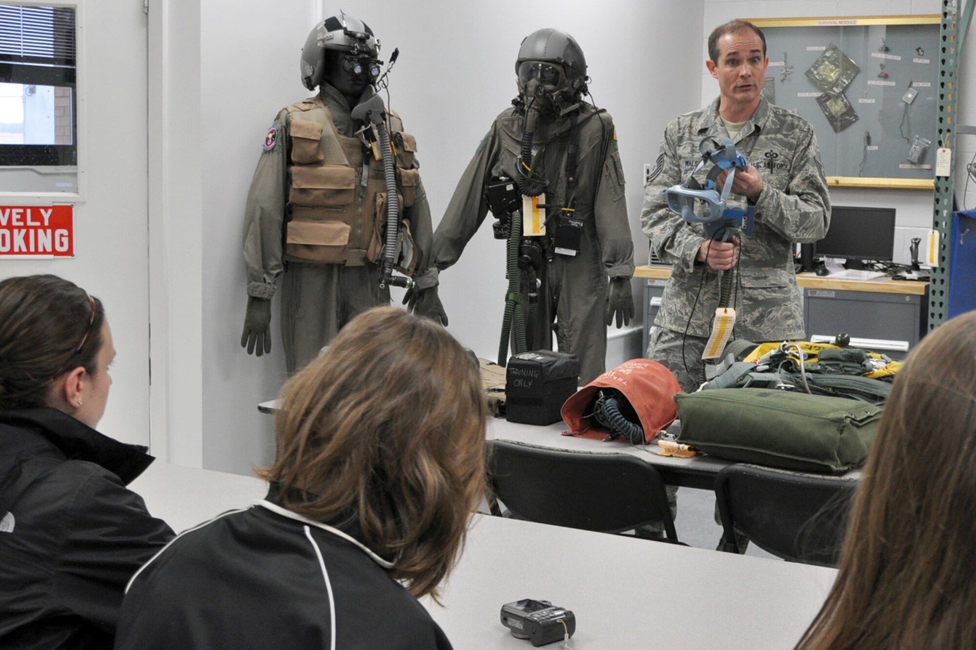 YOUNGSTOWN AIR RESERVE STATION, Ohio – Air Force Reserve Senior Tech. Sgt. Phil Walsh, an Aircrew Flight Equipment craftsman assigned to the 910th Operations Support Squadron, shows an oxygen mask, used aboard C-130 Hercules aircraft, to members from the nearby Kent State University chapter of the Women in Aviation (WIA) group here, Feb. 24, 2012. The students, who are pursuing various degrees in the field of aviation, received a close up view of several pieces of aircrew survival equipment as part of the group’s visit to YARS and the adjacent Youngstown-Warren Regional Airport. U.S. Air Force photo by Master Sgt. Bob Barko Jr.