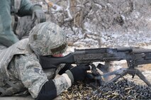 Senior Airman David Eastridge, 302nd Security Forces Squadron, lights up the range with an M240B Machine Gun. The M240B is capable of unleashing 950 rounds per minute and has an effective range of 1,980 yards. The Airman along with other 302nd SFS members spent the day at the Berkeley Airburst Range, Pueblo County, qualifying on both the M240B and the M249 Squad Automatic Weapon. (U.S Air Force photo/Tech. Sgt. Peter Dean)