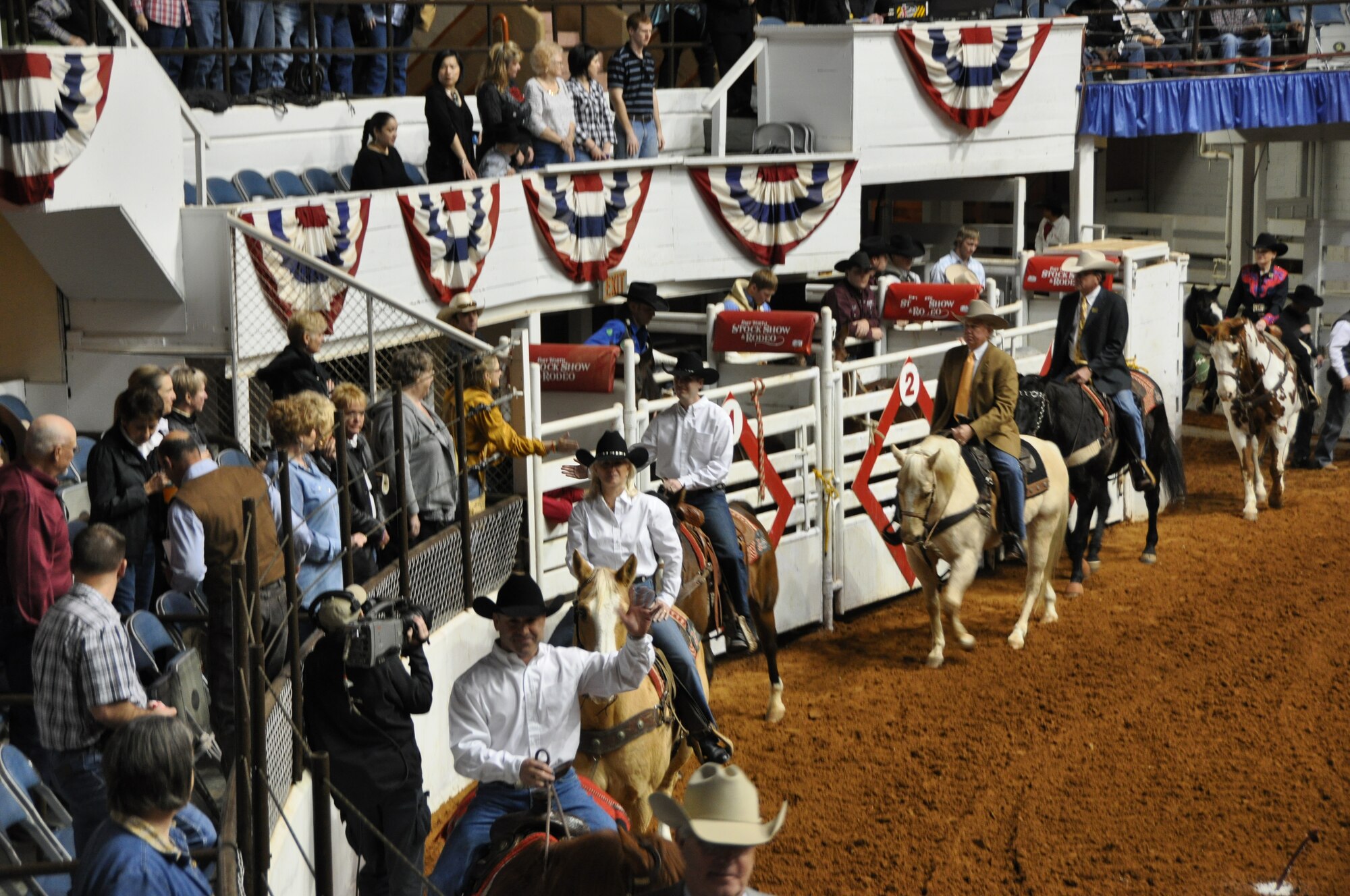 Col. Kurt Gallegos, 301st Operations Group commander (foreground riding in white shirt), rides in the opening processional ceremony of the 2012 Fort Worth Annual Stock Show and Rodeo. Gallegos has been an avid horse rider and champion rodeo rider for more than 30 years. The Fort Worth rodeo is one of the oldest and most widely respected in the country. (U.S. Air Force photo/TSgt Shawn David McCowan)