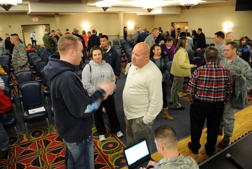 Housing residents discuss the upcoming housing privatization issue with base officials after a Feb. 23, 2012, town hall meeting on Grand Forks Air Force Base, N.D. (U.S. Air Force photo/Tim Flack)
