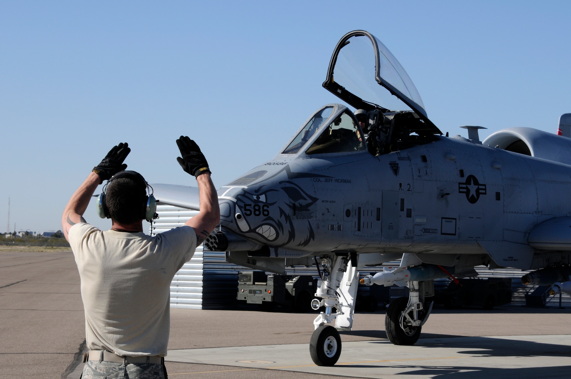 A crew chief with the 188th Fighter Wing marshals an A-10C Thunderbolt II “Warthog” at Davis-Monthan Air Force Base, Ariz., Feb. 21. The 188th deployed approximately 300 Airmen to Davis-Monthan AFB to participate in Operation Snowbird in preparation for the Flying Razorbacks’ deployment to Afghanistan this summer. (National Guard photo by Senior Master Sgt. Dennis Brambl/188th Fighter Wing Public Affairs)


