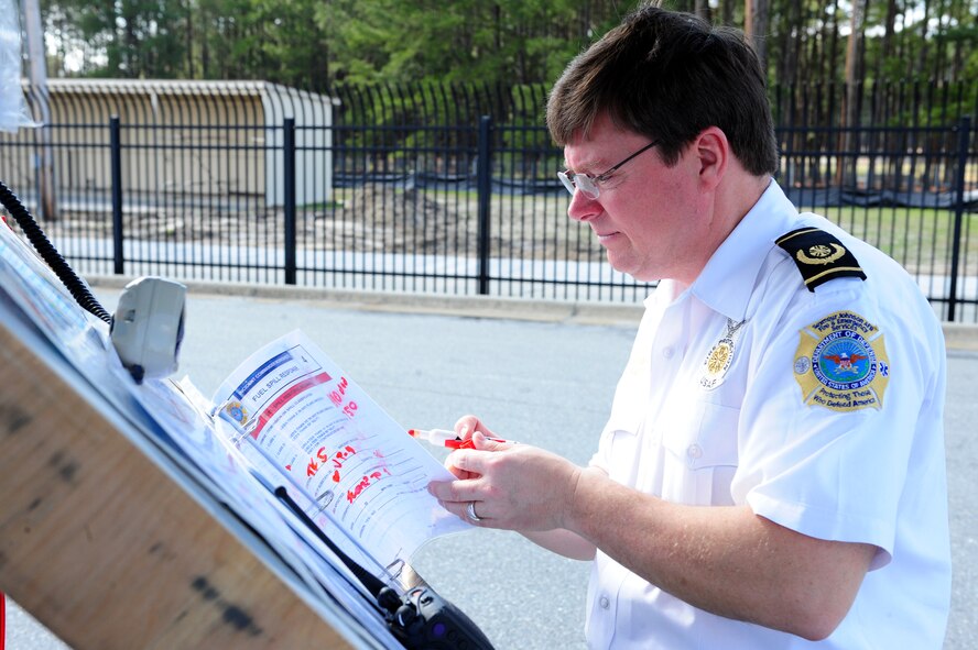 Sean Quinby reviews a hazmat and chemical spill checklist during a fuel spill exercise on Seymour Johnson Air Force Base, N.C., Feb. 23, 2012. The exercise simulated a spillage of oil that leaked into the base’s water drains. This scenario was designed to test how Airmen and base personnel respond to a large oil spill incident. Quinby, 4th Civil Engineer Squadron fire emergency services flight chief, hails from Seattle. (U.S. Air Force photo/Airman 1st Class Mariah Tolbert/Released)