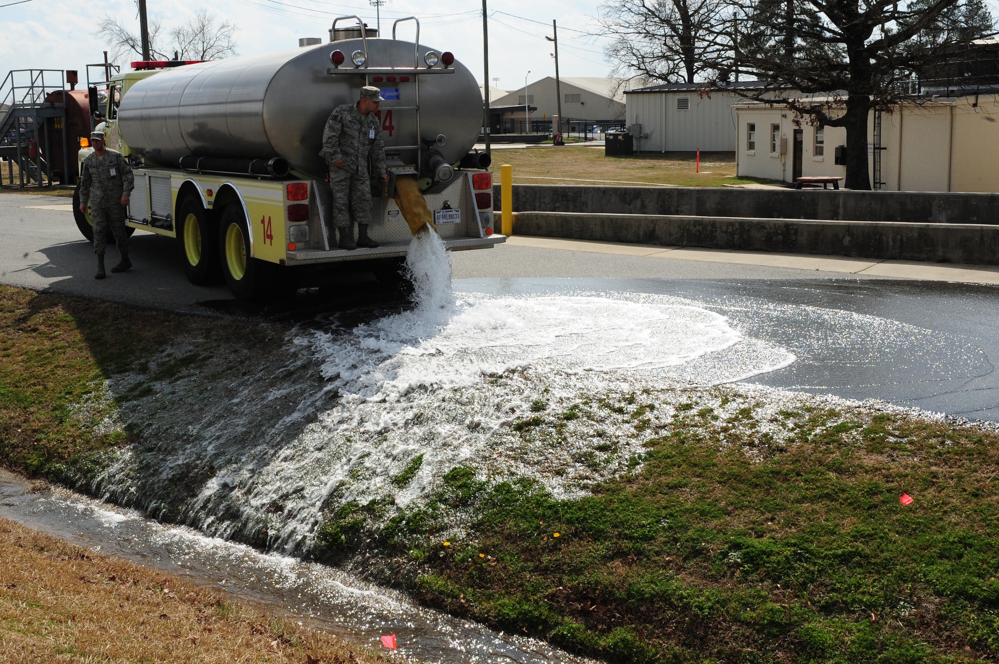 U.S. Air Force Staff Sgt. Skipper Valentin-Cruzado releases simulated fuel from a water truck during a fuel spill exercise on Seymour Johnson Air Force Base, N.C., Feb. 23, 2012. In accordance with the Oil Pollution Act of 1990, contractors from the Defense Logistics Agency perform training and conduct an annual oil spill exercise to evaluate the base’s response. Valentin-Cruzado, 4th Civil Engineering Squadron fire inspector, hails from Puerto Rico. (U.S. Air Force photo/Airman 1st Class Mariah Tolbert/Released)