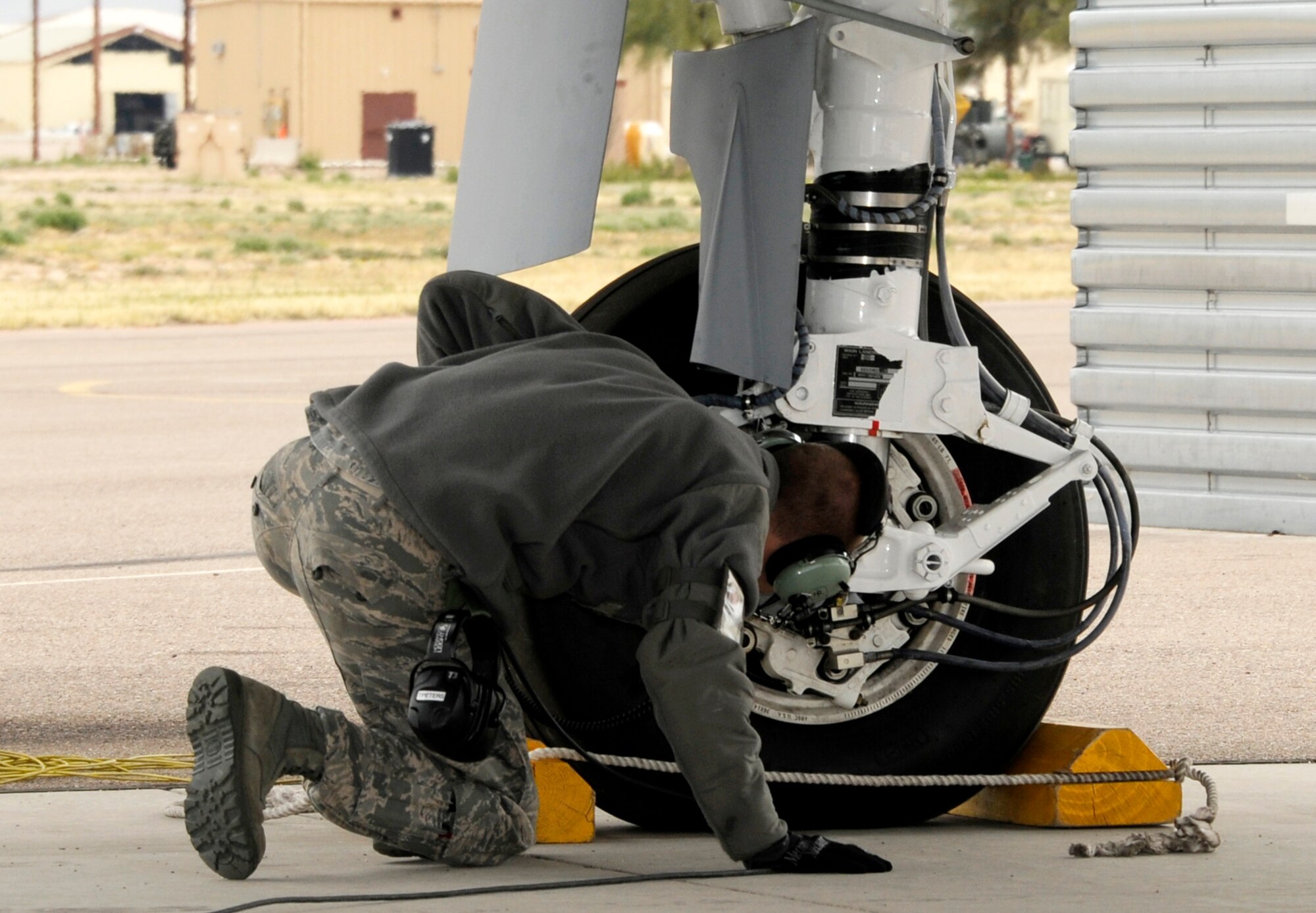 A crew chief with the 188th Fighter Wing conducts a brake inspection on an A-10C Thunderbolt II “Warthog” prior to taxiing at Davis-Monthan Air Force Base, Ariz., Feb. 17. The 188th deployed approximately 300 Airmen to Davis-Monthan AFB to participate in Operation Snowbird in preparation for the Flying Razorbacks’ deployment to Afghanistan this summer. (National Guard photo by Senior Master Sgt. Dennis Brambl/188th Fighter Wing Public Affairs)


