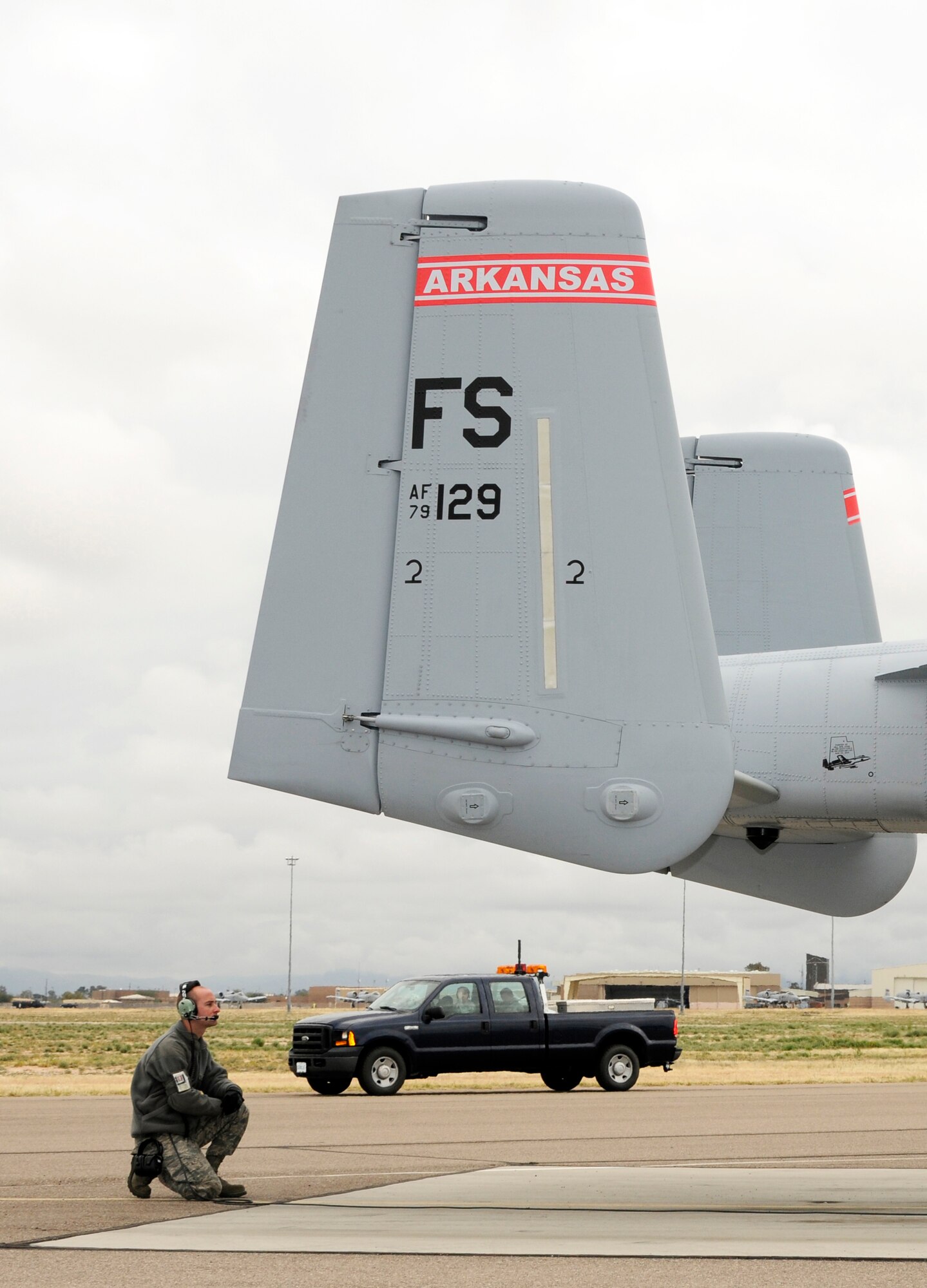 A crew chief with the 188th Fighter Wing communicates with an A-10C Thunderbolt II “Warthog” pilot during preflight checks prior to taxiing at Davis-Monthan Air Force Base, Ariz., Feb. 17. The 188th deployed approximately 300 Airmen to Davis-Monthan AFB to participate in Operation Snowbird in preparation for the Flying Razorbacks’ deployment to Afghanistan this summer. (National Guard photo by Senior Master Sgt. Dennis Brambl/188th Fighter Wing Public Affairs)

