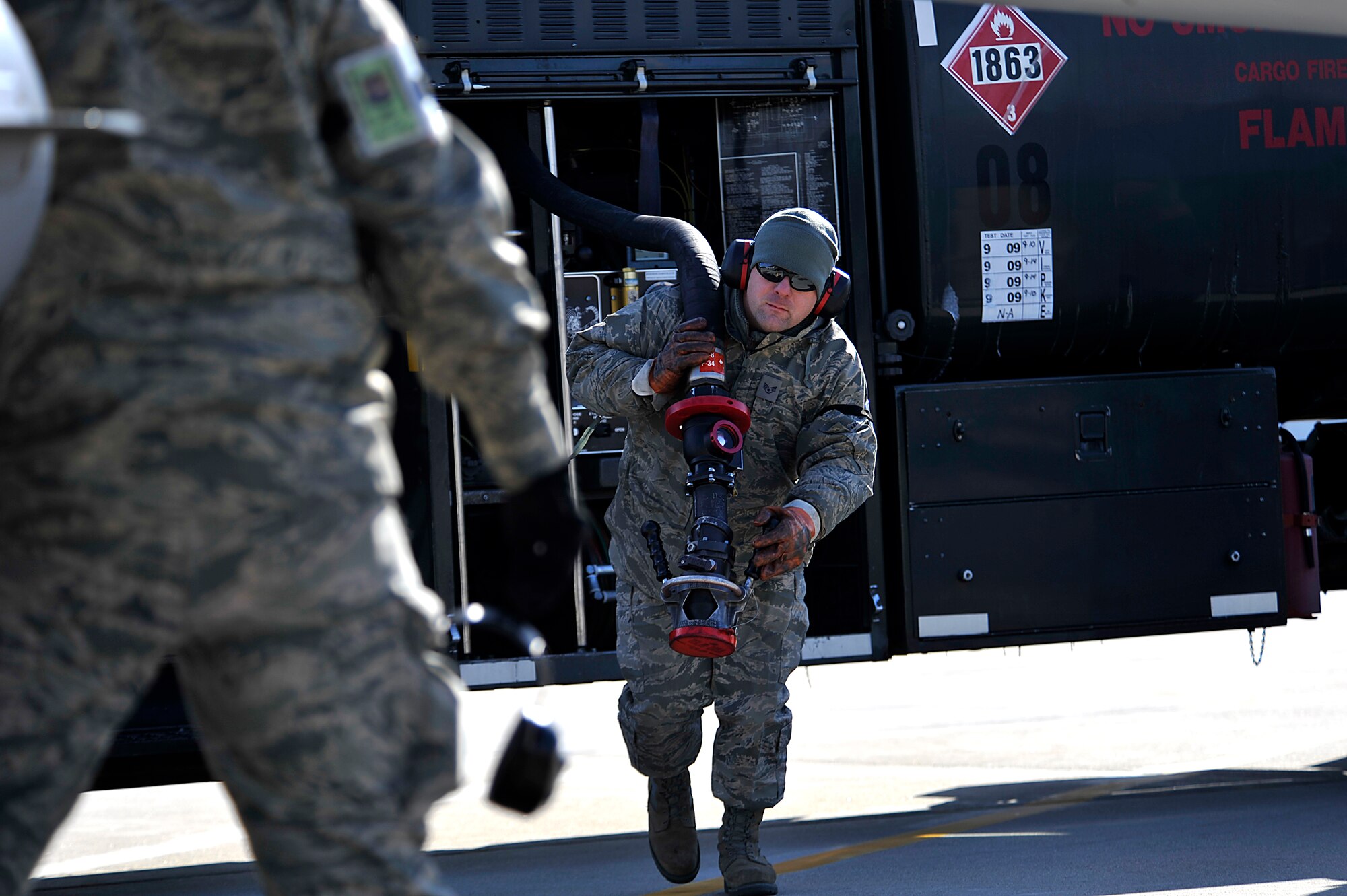 Staff Sgt. Chad Lavigne prepares to refuel an F-16 Fighting Falcon Feb. 12, 2012, at the Ohio Air National Guard Base. The F-16 is a part of the field service evaluation for biofuel operations. Lavigne is a fuels specialist assigned to the 180th Mission Support Group. (U.S. Air Force photo/Master Sgt. Jeremy Lock)