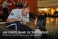 U.S. Air Force Band of the Pacific band member Staff Sgt. Mike Henrie signs a pair of drum sticks for a young concert goer following a performance Feb. 10, 2012, at a mall in Angeles City, Philippines. The band gave nine performances during the four-day 2012 Philippines International Hot Air Balloon Fiesta. (U.S. Air Force photo/Maj. Michael Willen)