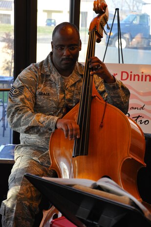Tech. Sgt. Terry Grace, U.S. Air Force Band of the Golden West, plays the bass during the Hearts Apart dinner at the Contrails Dining Facility at Beale Air Force Base, Calif., Feb. 15, 2012. The band Mobility played during the dinner which was for members of Team Beale who have spouses deployed. (U.S. Air Force photo by Staff Sgt. Robert M. Trujillo/Released)
