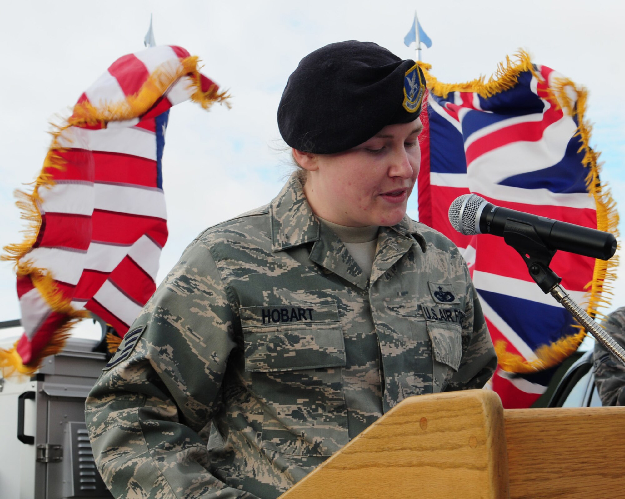 RAF MILDENHALL, England – Staff Sgt. Hannah Hobart, 100th Security Forces Squadron Military Working Dog section, reads a poem, “Guardians of the Night,” during the retirement ceremony of Military Working Dog Desant Feb. 24, 2012, at the MWD facility here. After eight years serving the U.S. Air Force, and amassing 9,000 working hours, Desant was retired after suffering from medical problems for several years. (U.S. Air Force photo/Karen Abeyasekere)