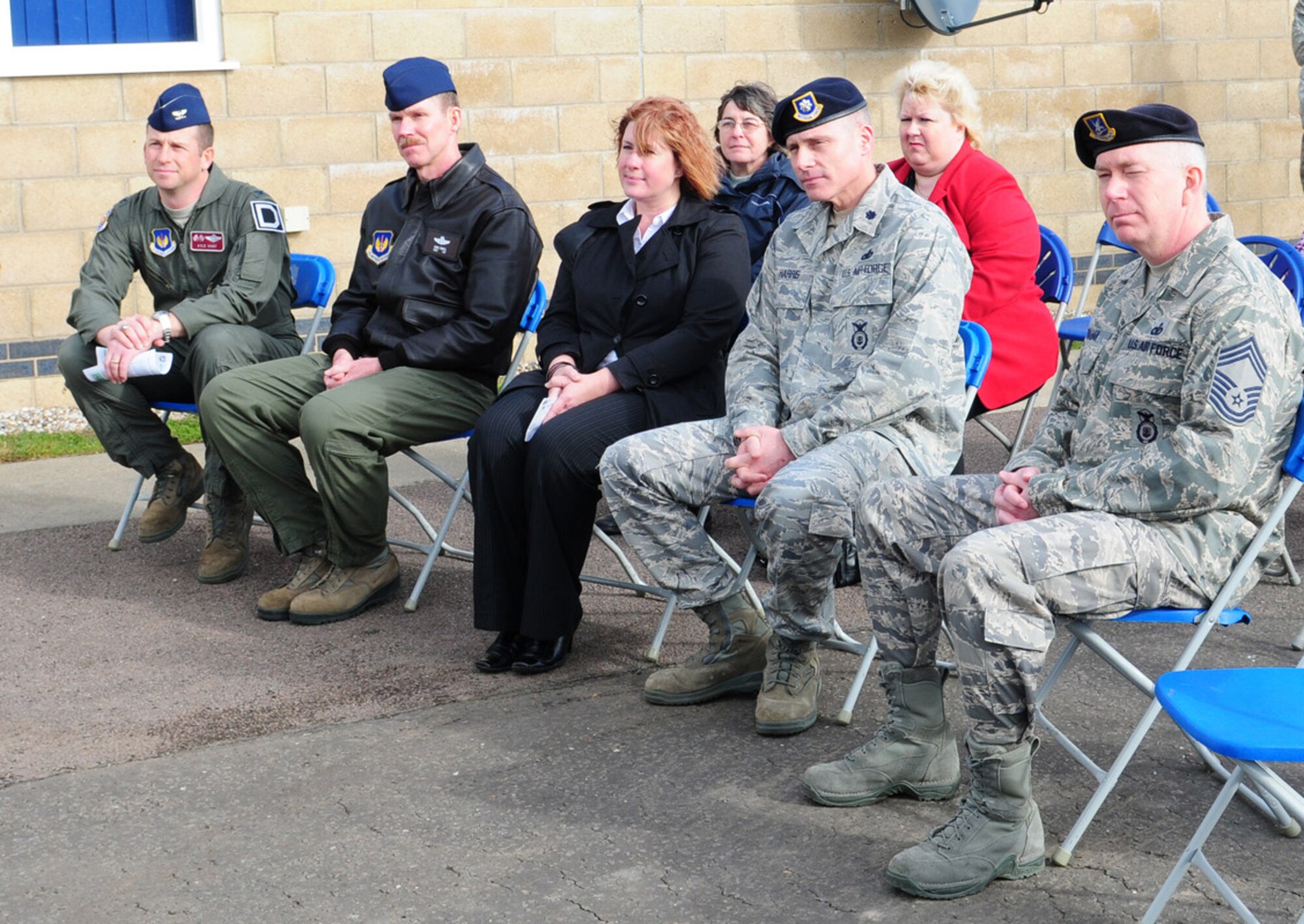 RAF MILDENHALL, England – (From left) Col. Kyle Voigt, 100th Air Refueling Wing vice commander; Chief Master Sergeant Christopher Powell, 100th ARW command chief; Sharon Powell, spouse of 100th ARW command chief; Lt. Col. David Harris, 100th Security Forces Squadron commander; and Chief Master Sgt. Daniel Trahan, 100th SFS, attended the retirement ceremony of Military Working Dog Desant here Feb. 24, 2012. (U.S. Air Force photo/Karen Abeyasekere)