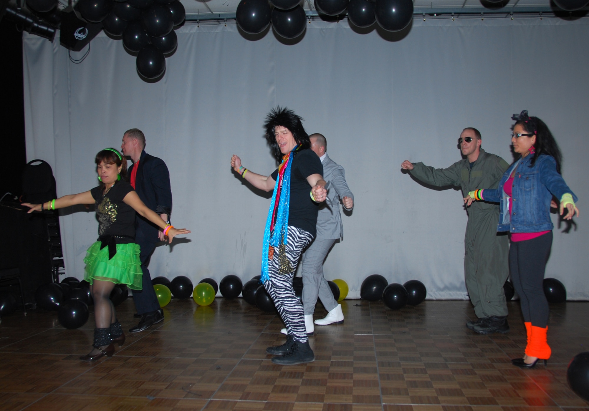 THULE AIR BASE, Greenland – The 821st Air Base Group held an ’80s party Feb. 18 at the Top of the World Club. Thule Air Base, located more than 750 miles north of the Arctic Circle, is one of the six installations operated by the 21st Space Wing and hosts part of the 21st Space Wing's global network of sensors providing missile warning, space surveillance and space control. (U.S. Air Force photo/Zhenhua Xie)

