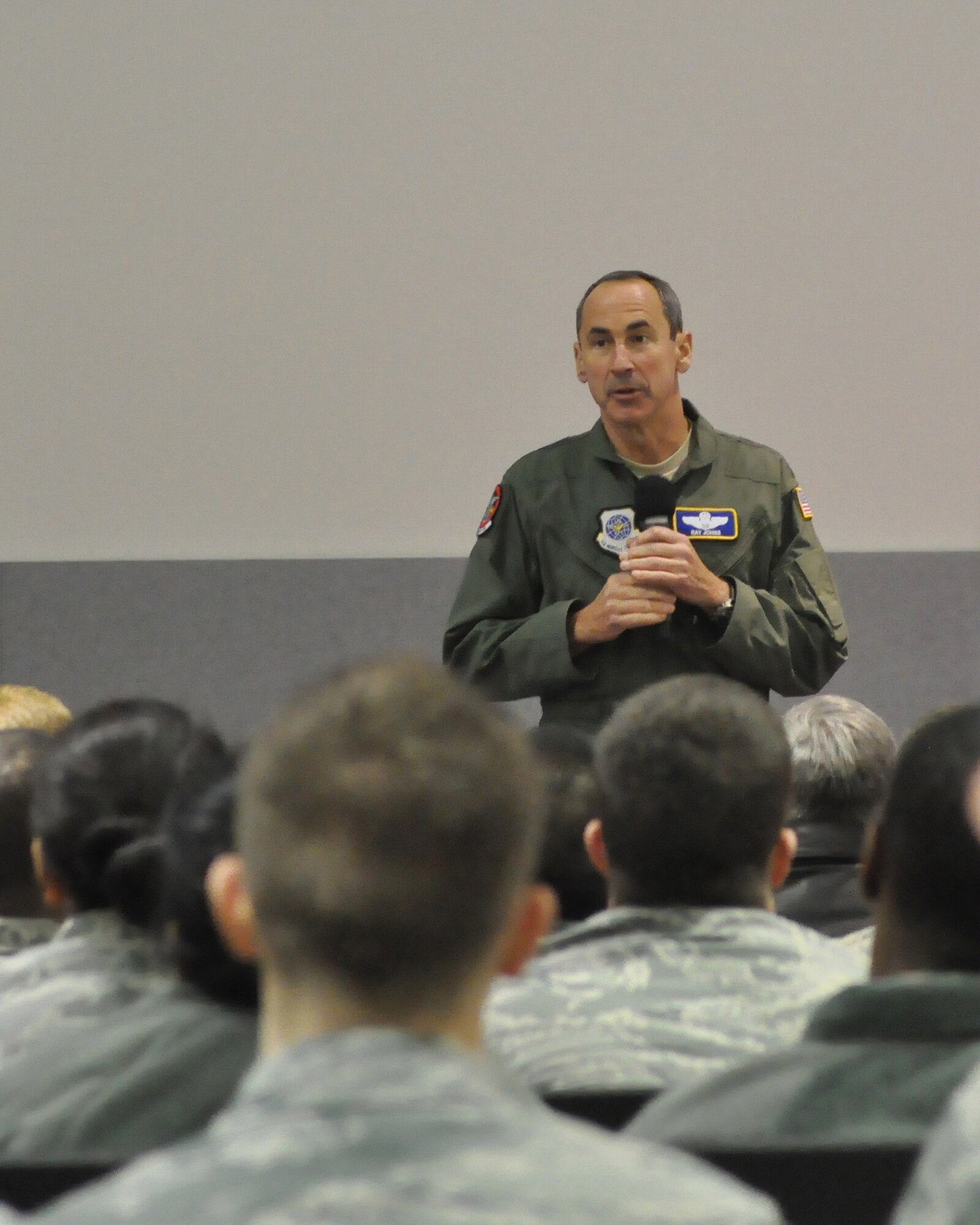 Gen. Raymond E. Johns, Jr., Air Mobility Command commander, addresses Airmen during a commander's call Feb. 24, 2012, at Joint Base Lewis-McChord, Wash. Johns thanked the Airmen for their hard work and dedication toward accomplishing the mission. (U.S. Air Force photo/Staff Sgt. Frances Kriss) 