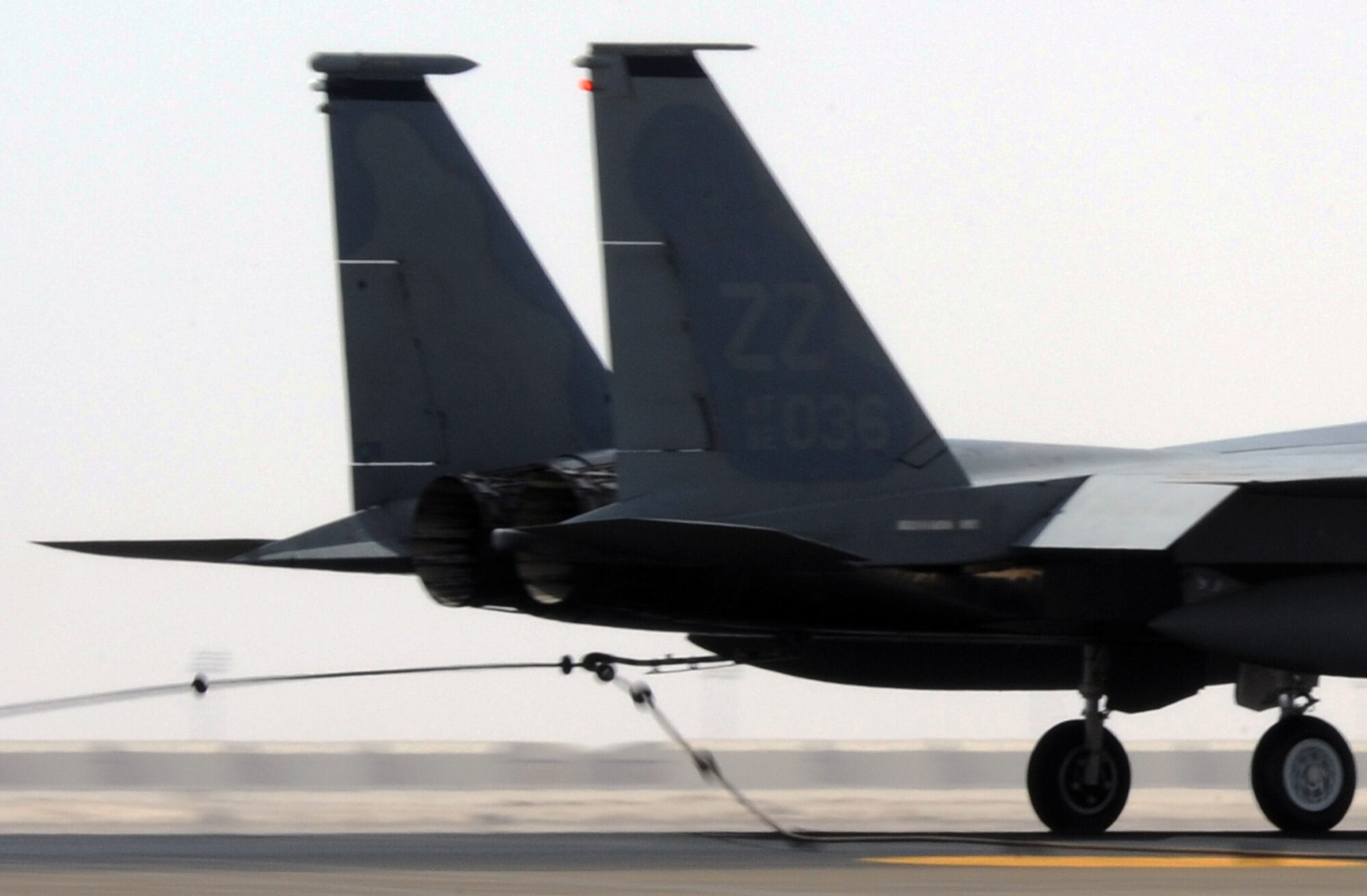 SOUTHWEST ASIA - An F-15 Eagle tests a new arresting barrier system for the 380th Air Expeditionary Wing Feb. 25, 2012. The system consists of a cable stretched across a flightline and hooked up to motorized retractors on either side. If a fighter has some type of malfunction that affects its brakes, pilots can use the arresting cable to stop safely. This was the certification test for a new system, which has to be replaced every 10 years. (U.S. Air Force photo/Staff Sgt. J.G. Buzanowski)