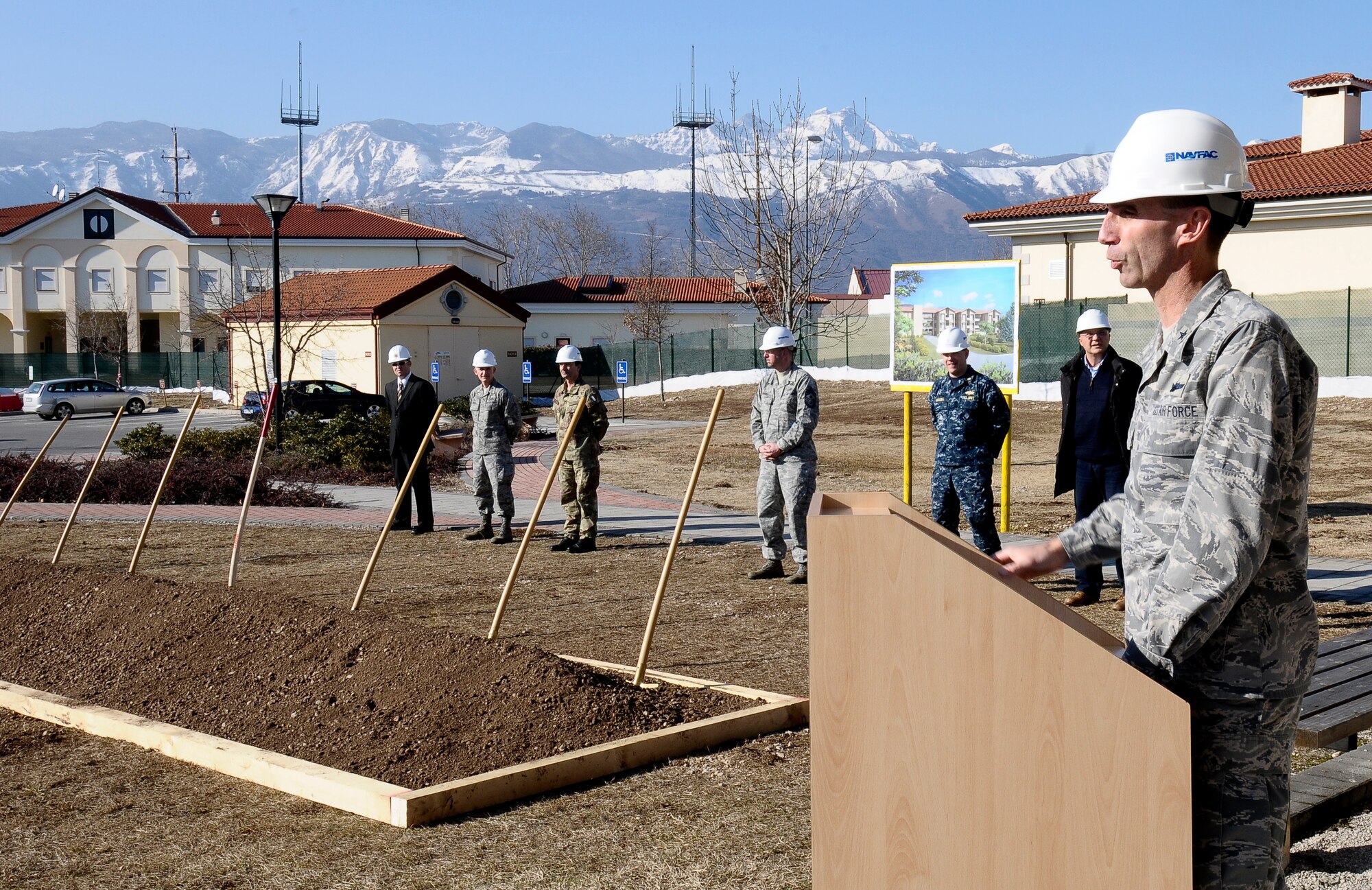Brig. Gen. Scott Zobrist, 31st Fighter Wing commander, exalts the virtues of a new, energy-efficient dormitory being built Feb. 23 at Aviano Air Base, Italy. Wing leadership plans to move all U.S. Air Force assets out of Area 2, returning it to the Italian air force. The new dormitory will remove the plan’s primary roadblock. The facility also has a Leadership in Energy and Environmental Design silver-certified rating for efficiency, significantly reducing the Air Force’s carbon footprint and utility bill. (U.S. Air Force photo/Senior Airman Katherine Windish)