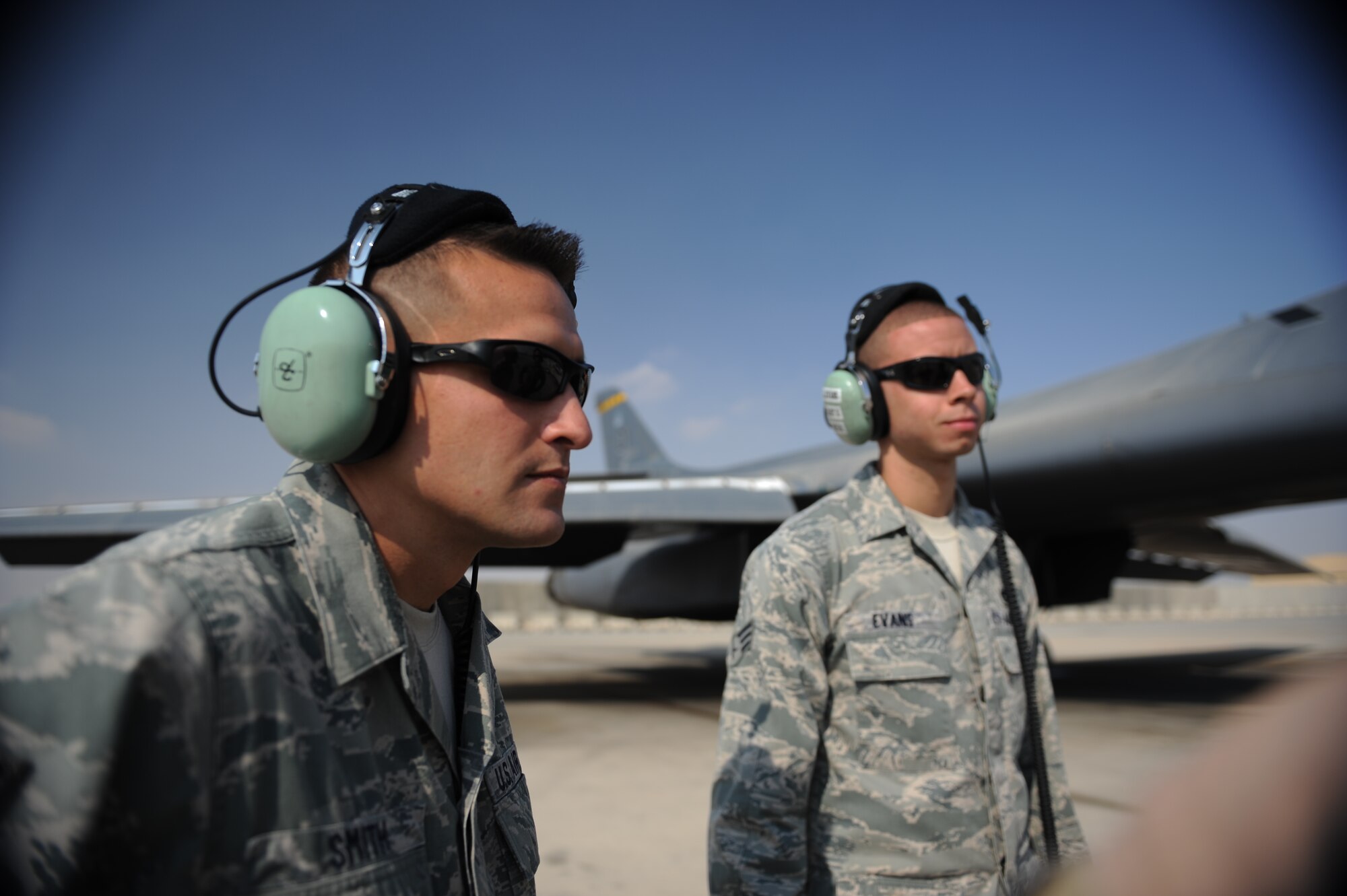 Staff Sgt. Marcus Smith and Senior Airman Alex Evans, 9th Expeditionary Aircraft Maintenance Unit crew chiefs, prepare to launch a B-1 here Feb. 26, 2012. Crew chiefs oversee all maintenance on an aircraft and ensure it is mission-ready. Smith is a native of Portsmount, Va., and Evans is a native of Pembroke, N.C. (U.S. Air Force photo/Staff Sgt. Nathanael Callon)
