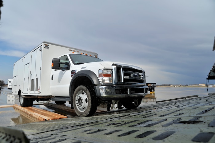 Marines from the II Marine Expeditionary Force, Chemical Biological Incident Response Force, Initial Response Force 'A' load CBIRF response vehicles onto a C-5 Galaxy bound for Japan, Apr. 1, 2011. Based at Naval Suport Facility Indian Head Maryland, CBIRF is a unit comprised of Marines and sailors specially trained to counter the effects of a chemical, biological, radiological, nuclear, and high-yeild explosive (CBRNE) incident. Usually, that intails being available to assist local, state and federal agencies with domestic emergency responses to CBRNE incidents. This is CBIRF's first  overseas deployment since it was stood up in 1996 in response to the sarin attack on Tokyo subway in 1995.(Released)