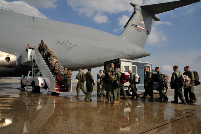 Marines from II Marine Expeditionary Force, Chemical Biological Incident Response Force, Initial Response Force 'A' board a C-5 Galaxy bound for Japan, April. 1 2011 at Joint Base Andrews, Md. The Marine unit is specially trained to counter the effects of a chemical, biological, radiological, nuclear or high-yeild explosive (CBRNE) incident. Will Provide the U.S. on-scene commander a rapid response capability and, if requested, [allow the commander to] assist Japanese authorities by providing advice and expertise in the areas of agent detection and identification, casualty search and rescue, personnel decontamination and emergency medical care. This is CBIRF's first  overseas deployment since it was stood up in 1996 in response to the sarin attack on Tokyo subway in 1995. (Released) 