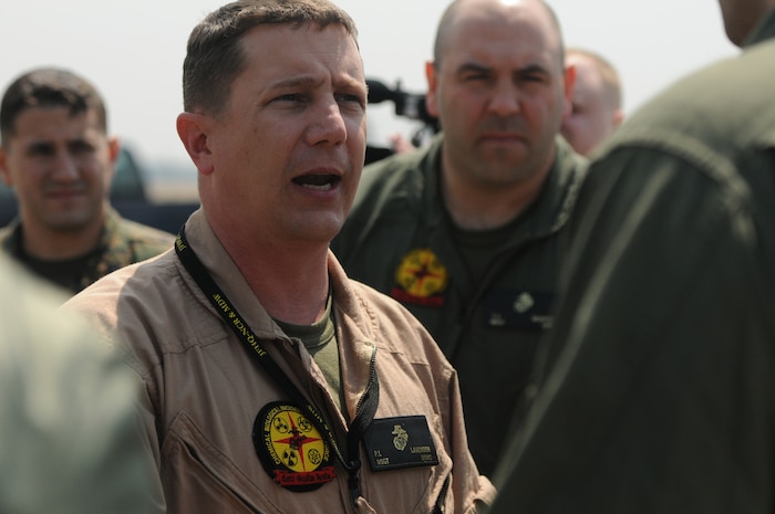 YOKOTA AIR BASE, Japan -- A Marine from the Chemical Biological Incident Response Force, II Marine Expeditionary Force deployed with an Initial Response Force (IRF) to Japan in support of Operation Tomodachi gives a brief on what they are going to expect. Approximately 15 members of the IRF deployed from Indian Head, Md. and have arrived at approximately 11 a.m. local time April 2, here at Yokota Air Base. The IRF can forward-deploy and respond to chemical, biological, radiological, nuclear incidents in order to assist in the conduct for consequence management operations. An IRF accomplishes the misson by providing capabilities for agent detection and indentification; casualty search, rescue, and personnel decontamination; and emergency medical care and stabilization of contaminated personnel. The intended mission of this IRF is to assist, and train as necessary, the Japan Self Defense Forces in the techniques and procedures they are likely to need as they respond to this crisis. (Photo by Army Agt. Cashmere C. Jefferson, Joint Support Force Public Affairs).