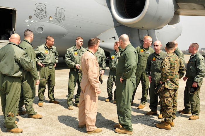 YOKOTA AIR BASE, Japan -- The Secretary of Defense recently approved the order for Chemical Biological Incident Response Force, II Marine Expeditionary Force to deploy an Initial Response Force (IRF) to Japan in support of Operation Tomodachi. Approximately 15 members of the IRF deployed from Indian Head, Md. and have arrived at approximately 11 a.m. local time April 2, here at Yokota Air Base. The IRF can forward-deploy and respond to chemical, biological, radiological, nuclear incidents in order to assist in the conduct for consequence management operations. An IRF accomplishes the misson by providing capabilities for agent detection and indentification; casualty search, rescue, and personnel decontamination; and emergency medical care and stabilization of contaminated personnel. The intended mission of this IRF is to assist, and train as necessary, the Japan Self Defense Forces in the techniques and procedures they are likely to need as they respond to this crisis. (Photo by Army Agt. Cashmere C. Jefferson, Joint Support Force Public Affairs).