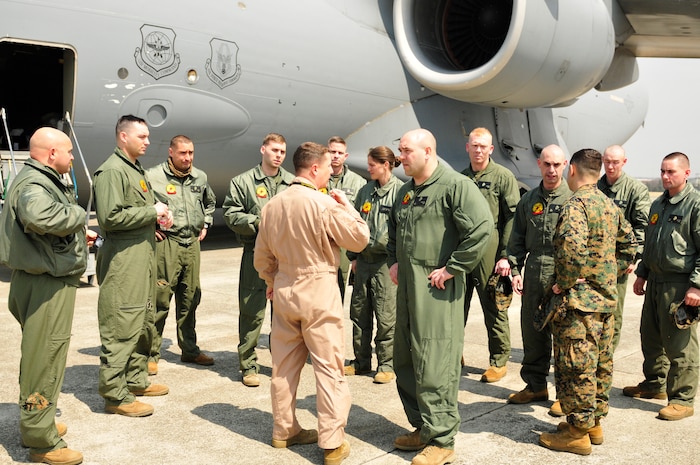 YOKOTA AIR BASE, Japan -- The Secretary of Defense recently approved the order for Chemical Biological Incident Response Force, II Marine Expeditionary Force to deploy an Initial Response Force (IRF) to Japan in support of Operation Tomodachi. Approximately 15 members of the IRF deployed from Indian Head, Md. and have arrived at approximately 11 a.m. local time April 2, here at Yokota Air Base. The IRF can forward-deploy and respond to chemical, biological, radiological, nuclear incidents in order to assist in the conduct for consequence management operations. An IRF accomplishes the misson by providing capabilities for agent detection and indentification; casualty search, rescue, and personnel decontamination; and emergency medical care and stabilization of contaminated personnel. The intended mission of this IRF is to assist, and train as necessary, the Japan Self Defense Forces in the techniques and procedures they are likely to need as they respond to this crisis. (Photo by Army Agt. Cashmere C. Jefferson, Joint Support Force Public Affairs).