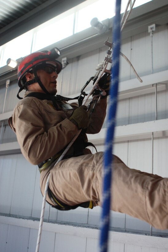 RANDALL’S ISLAND, N.Y. – Lance Cpl. Brandon Chapoy, with Extraction Platoon Initial Response Force B, Chemical Biological Incident Response Force gets cross training in rope rescue from New York City Fire Department’s Special Operations Command fire fighters. Marines and sailors of CBIRF went through a week-long training evolution involving vehicle extrication, rope rescue, and breaching and breaking through concrete. CBIRF’s Marines and sailors have trained with FDNY since July of 2000. Deputy Chief Raymond M. Downey, of FDNY’s SOC, helped CBIRF develop their technical rescue program before he later died on 9/11 in the World Trade Center towers. (released)
