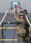 Sgt. Nick Janey, a technical rescue Marine with Chemical Biological Incident Response Force’s Technical Rescue Platoon, retrieves the rope used to pull the victim safely from the opposite tower. This type of rescue keeps victims from being exposed to any additional exposure to “contamination.” During the joint 72-hour technical rescue training operation with the 911th U.S. Army Technical Rescue Engineer Company at Downey Responder Training Facility the two units encountered five of the 6 rescue disciplines, confined space, vehicle extrication, trench rescue, high-angle rope rescue and structural collapse.