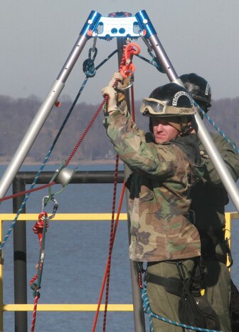Sgt. Nick Janey, a technical rescue Marine with Chemical Biological Incident Response Force’s Technical Rescue Platoon, retrieves the rope used to pull the victim safely from the opposite tower. This type of rescue keeps victims from being exposed to any additional exposure to “contamination.” During the joint 72-hour technical rescue training operation with the 911th U.S. Army Technical Rescue Engineer Company at Downey Responder Training Facility the two units encountered five of the 6 rescue disciplines, confined space, vehicle extrication, trench rescue, high-angle rope rescue and structural collapse.