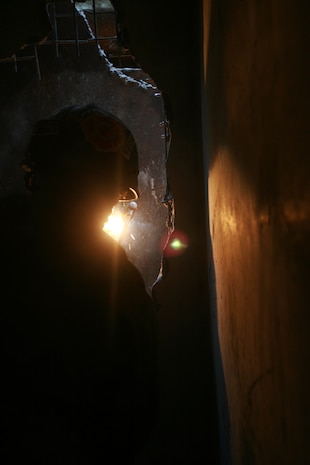 Technical rescue Marine with Chemical Biological Incident Response Force’s Technical Rescue Platoon attempts to cut through a steel plate in order to gain access to a tunnel where rescuers believe “victims” could be trapped during a simulated collapse during the joint 72-hour technical rescue training operation with the 911th U.S. Army Technical Rescue Engineer Company at the Downey Responder Training Facility. This technical rescue training operation at DRTF allowed the two units take the opportunity to train together to build a good working relationship and familiarity of each other’s capabilities and limitations, since they both cover the National Capitol Region they would work together if there were ever a disaster.