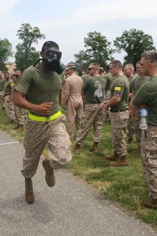 NAVAL SUPPORT FACILITY INDIAN HEAD, Md – Private First Class Jonathon D. James, Motor Transportation Operator, Headquarters and Support Company, Chemical Biological Incident Response Force races to the finish line in the gas mask relay race during CBIRF’s battalion field meet 24 May. Headquarters and Support Company, IRF A and IFR B all competed against one another in several events to strengthen unit cohesion and win bragging rights after the safety brief before the Memorial Day weekend.