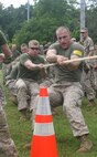 NAVAL SUPPORT FACILITY INDIAN HEAD, Md – Marines from Initial Response Force A, React Company, Chemical Biological Incident Response Force, pull their way to first place after a tug of war match against IRF B during CBIRF’s battalion field meet 24 May. Headquarters and Support Company, IRF A and IFR B all competed against one another in several events to strengthen unit cohesion after the safety brief before the Memorial Day weekend.