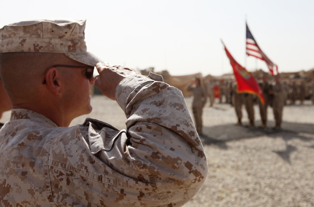 A Marine with 2nd Maintenance Battalion, 2nd Marine Logistics Group (Forward), renders honors during a transfer of authority ceremony aboard Camp Leatherneck, Afghanistan, Sept. 30. Second Supply Bn. took the reigns as Marine Air Ground Task Force Support Bn. 11.2 from 2nd Maintenance Bn. (U.S. Marine Corps photo by Sgt. Justin J. Shemanski)
 
