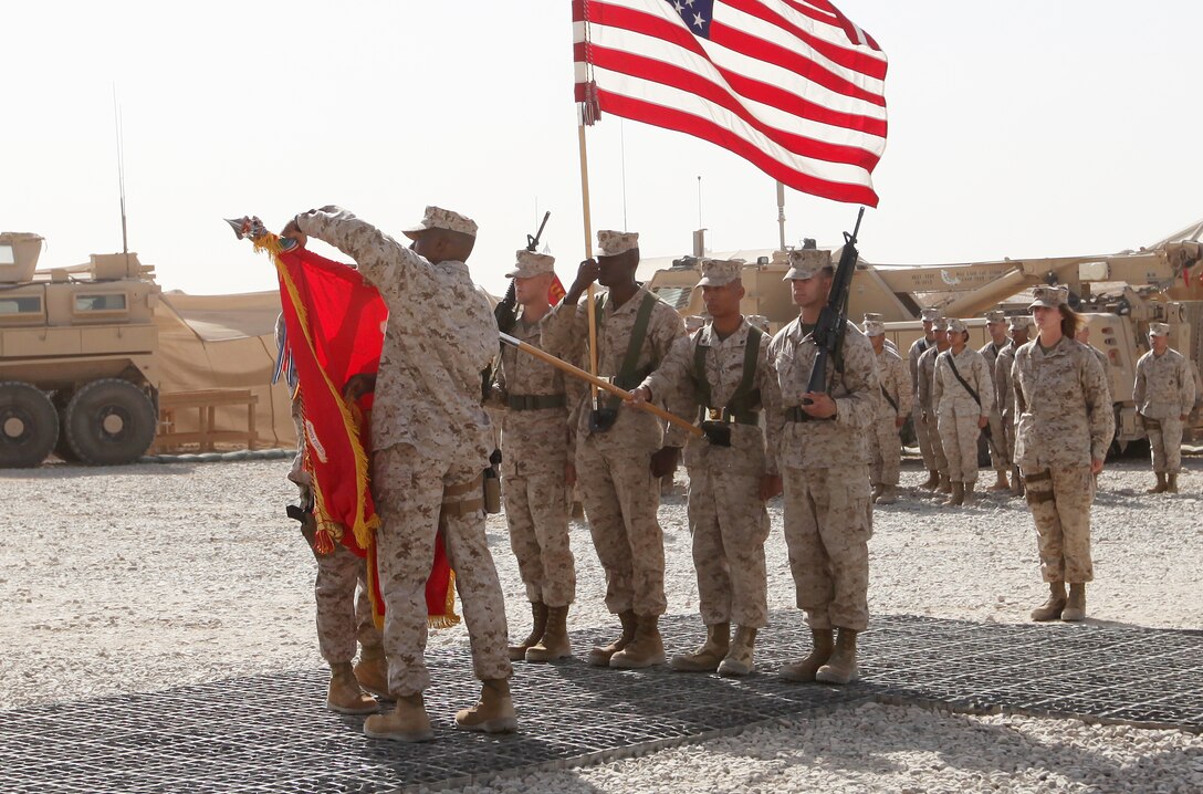 Lt. Col. David S. Gibbs, the commanding officer of Marine Air Ground Task Force Support Battalion 11.2, 2nd Marine Logistics Group (Forward), uncases the unit’s colors during a transfer of authority ceremony aboard Camp Leatherneck, Afghanistan, Sept. 30. The unit was preceded by 2nd Maintenance Bn., which after seven months of service in support of International Security Assistance Force operations will return to Camp Lejeune, N.C. (U.S. Marine Corps photo by Sgt. Justin J. Shemanski)  