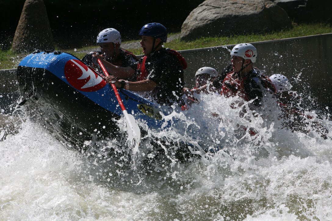 Marines with 1st Battalion, 10th Marine Regiment, 2nd Marine Division, navigate through different turns while whitewater rafting at the U.S. National Whitewater Center in Charlotte, N.C., Sept. 29. The Marines with 1/10 participated in different extreme and outdoor sports as part of Operation Adrenaline Rush, a program geared towards post-deployment stress management.