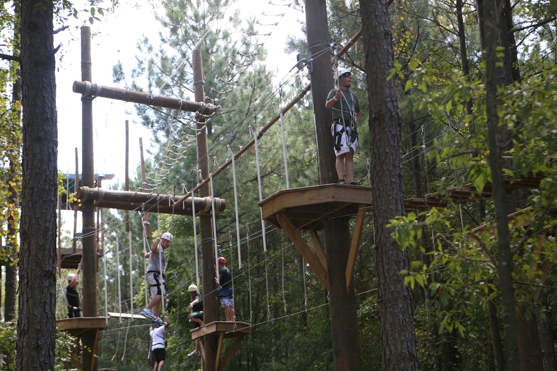 Marines with 1st Battalion, 10th Marine Regiment, 2nd Marine Division, navigate through a ropes course while at the U.S. National Whitewater Center in Charlotte, N.C., Sept. 29. The Marines with 1/10 participated in different extreme and outdoor sports as part of Operation Adrenaline Rush, a program geared towards post-deployment stress management.